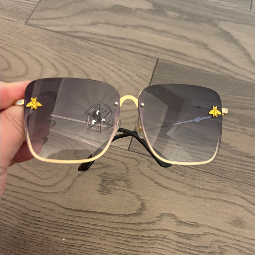 Gucci Gold Frame Sunglasses with Black Lenses